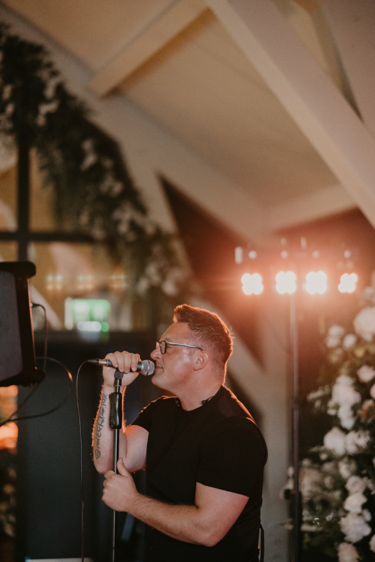 Singer performing with a live band